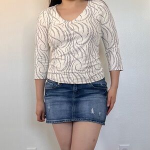 Vintage Y2K Dark wash Denim Low Rise Mini Skirt with a distressed look